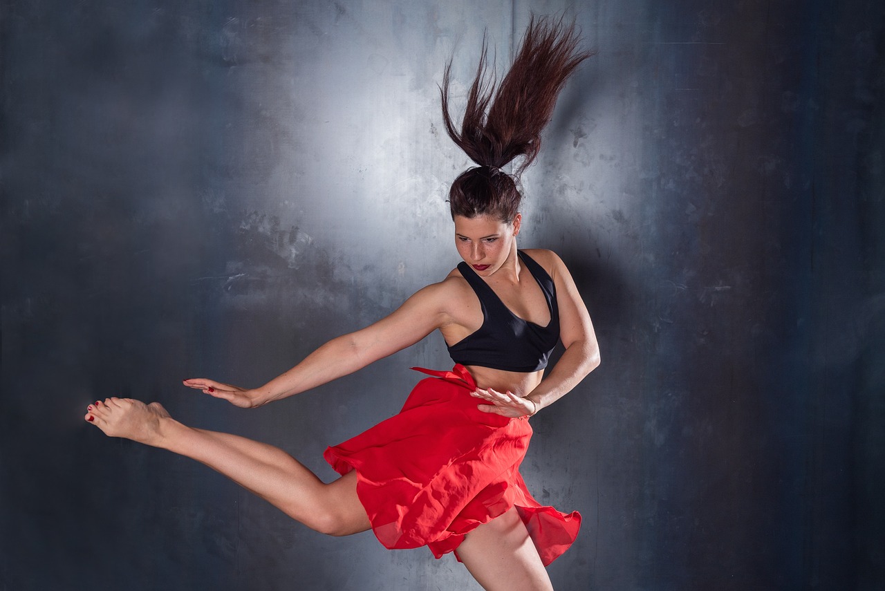 Jazz dancer in a dynamic pose, embodying high-energy theatricality.